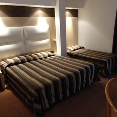 Eines der Zimmer des Hotels Conca Verde a Lignano