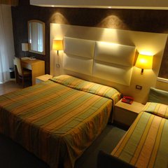 Eines der Schlafzimmer des Hotels Conca Verde in Lignano